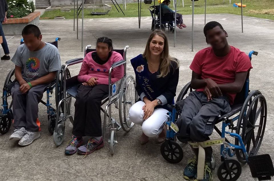 Volunteer working with disabled clients at the OSSO orphanage in Cuenca, Ecuador.