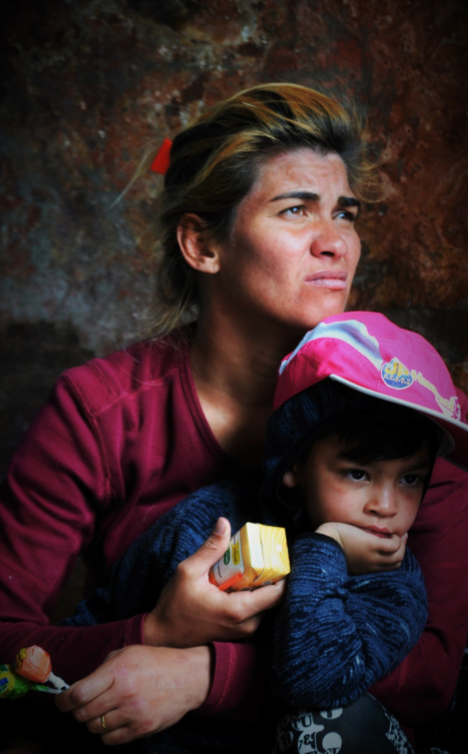 Mother and son receiving food assistance from our daily Food Outreach Program, which is one of several services provided by Snow Angels in Ecuador .